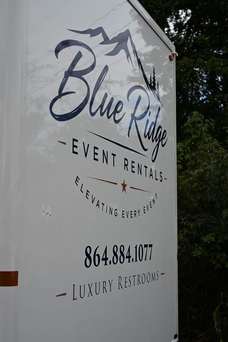 Blue Ridge Event Rentals branding on the restroom trailer exterior