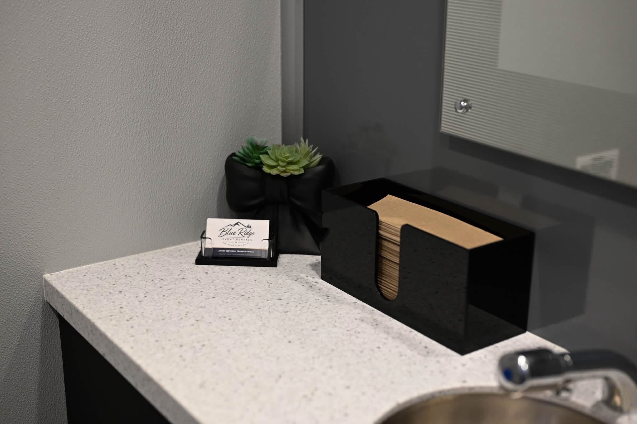 Blue Ridge restroom trailer vanity with hand towels and guest amenities